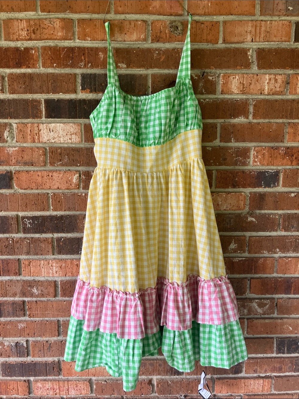 Beautiful pink, yellow, & green gingham print dress with ruffles.